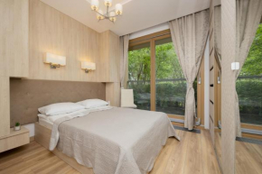 Apartment with Balcony in the Wola District of Warsaw by Noclegi Renters, Warsaw